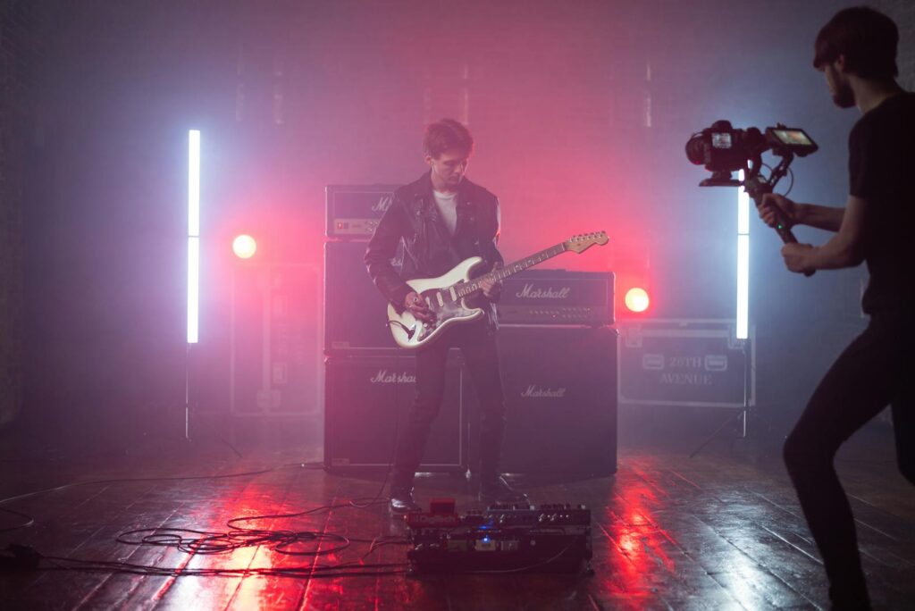 Man Playing Guitar on Stage