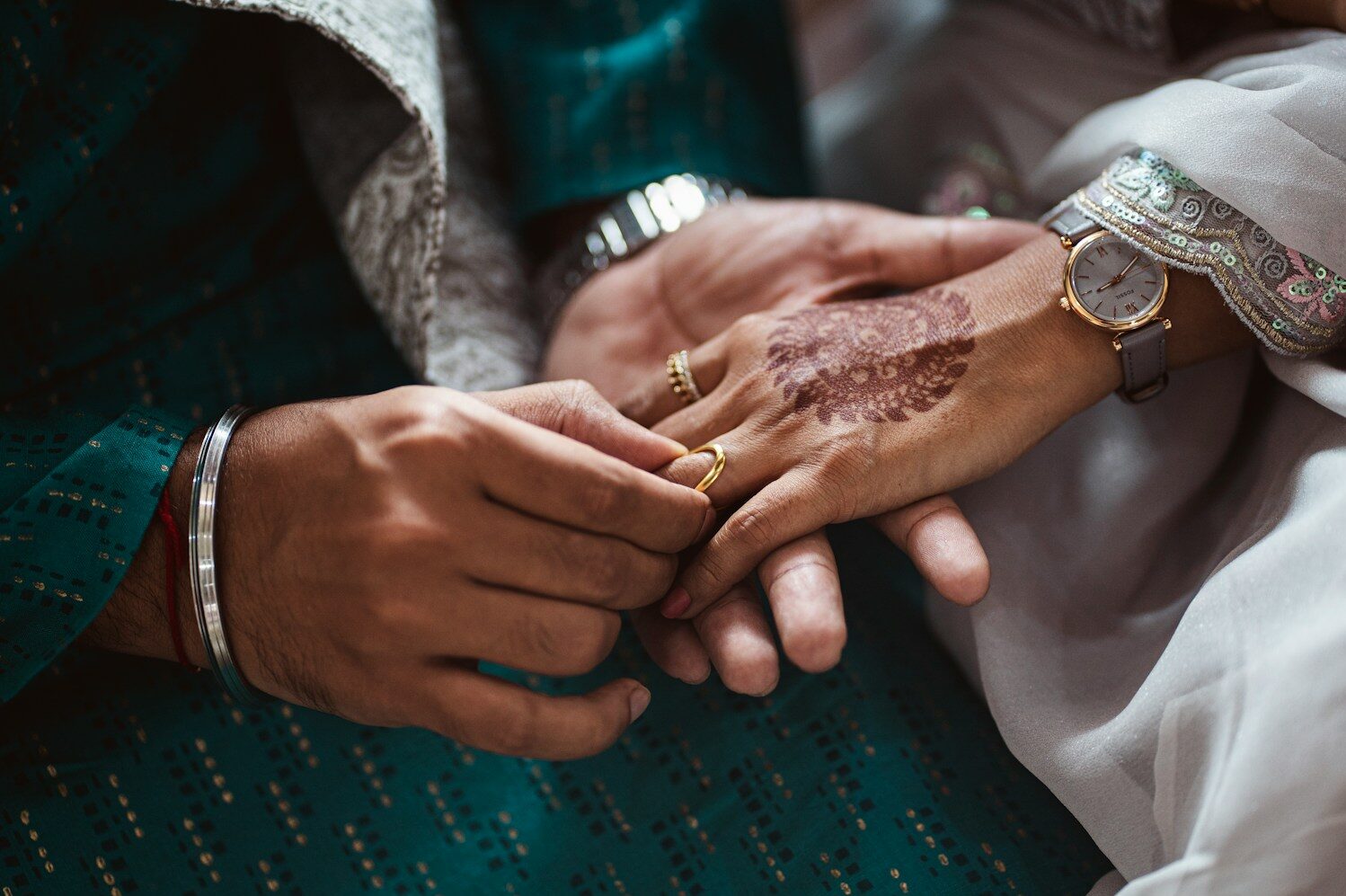 a close up of a person holding another person's hand